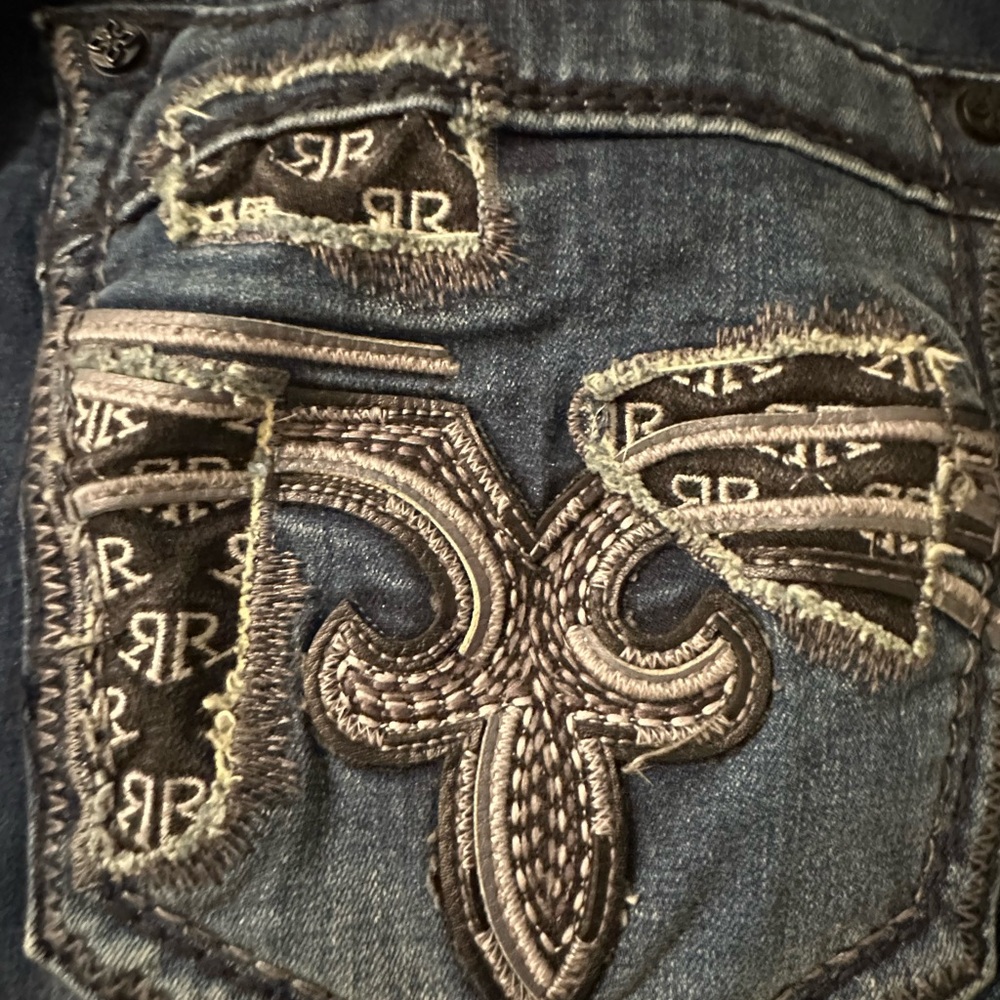 Rock Revival Distressed Blue Jeans with Black Accents